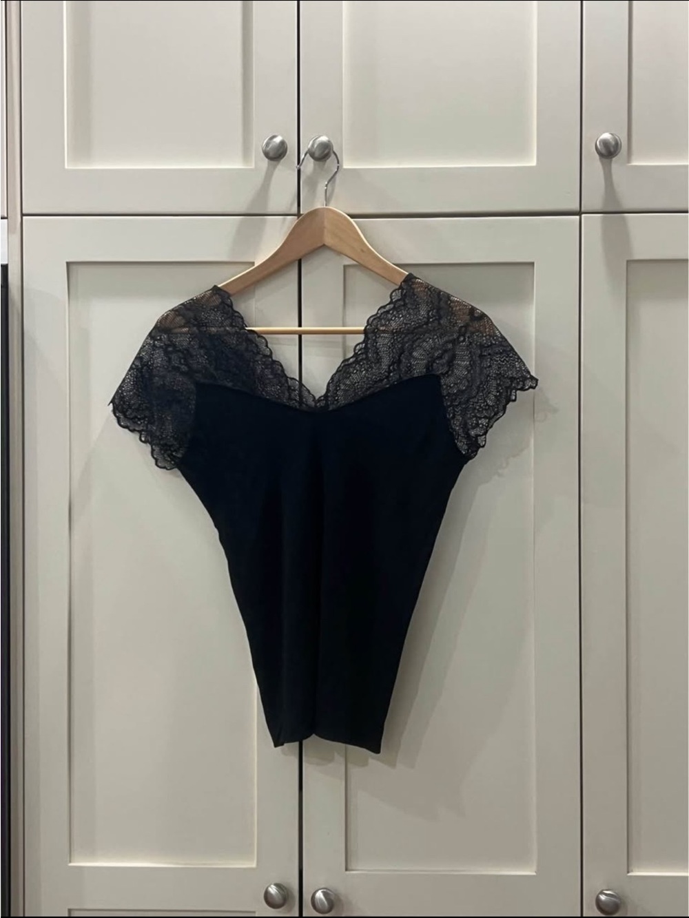 Black shirt with lace sleeves